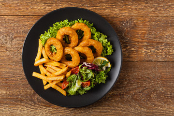 Roasted squid rings with fries