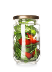 Delicious vegetable salad in mason jar on white background