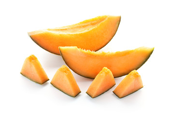 Slices of ripe melon on white background