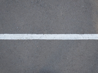 White strip on the gray asphalt