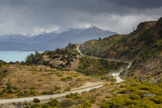 Carretera Austral Road in mountain landscape on cloudy day, Chile