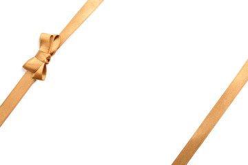 Golden ribbons with beautiful bow on white background