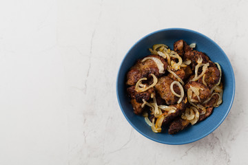 Fried chicken liver with onions.