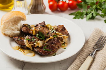 Fried chicken liver with onions.