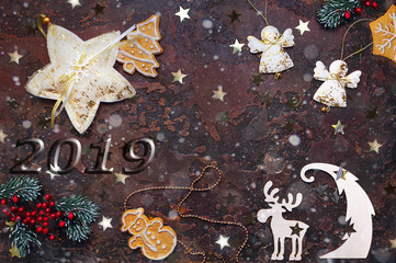 Background of New Year or Christmas decorations. Isolated on a dark background, top view, flat lay. Can be used for postcards, wallpapers and packaging. Dedicated focus, mockup