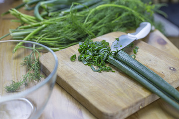 Onions for salad on a wooden board