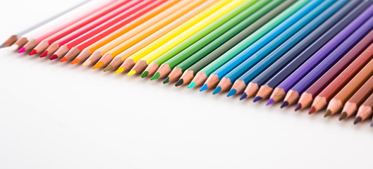 colored pencils lying in row