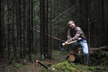 A bearded lumberjack with a large ax 