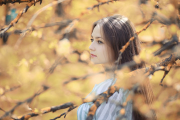 Young girl on a walk in the autumn 