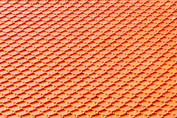 Orange tile roof at Buddhist temple. Square pattern background.