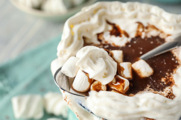 Cup of delicious cocoa with marshmallows, closeup