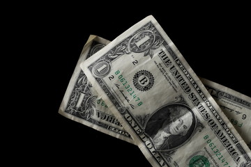 One dollar bill isolated on black background