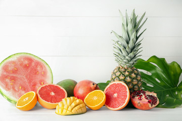 Various delicious fruits on light table