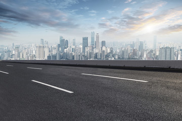 Fototapeta premium Road pavement and Chongqing urban architecture skyline