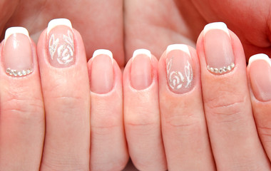 Woman's nails with beautiful french manicure fashion design