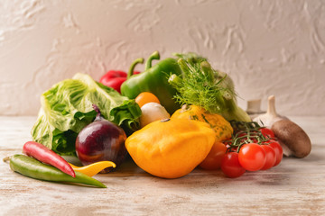 Various fresh vegetables on wooden table