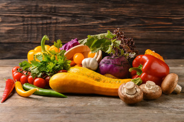 Various fresh vegetables on wooden table