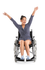 Happy Asian woman in wheelchair on white background