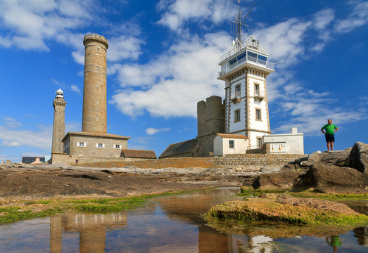 Beautiful view of the semaphore tower, the St. Peter chapel (Chapelle Saint-Pierre) and the Penmarc'h and the Eckmühl lighthouses in summer with a blue sky in Brittany (Bretagne), France
