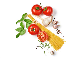 Spaghetti with tomatoes garlic and basil isolated on white background. Top view.
