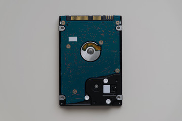 Hard Disk Drive (HDD) for laptops back view isolated at white background in center