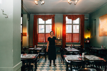 view of a restaurant interior within a beautiful waitress on the middle