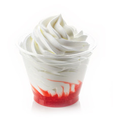 dessert of whipped cream and fresh berries in plastic cup isolated on white background