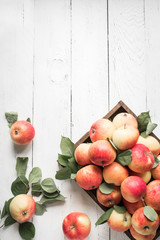 Red apples in wooden box