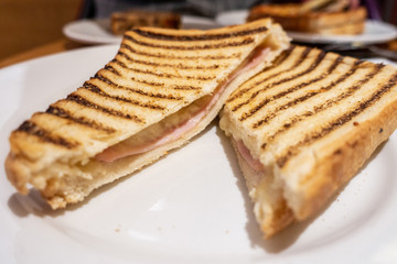 A ham and cheese toasted sandwich.