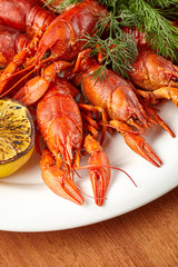 Cooked, beautiful crayfish on a plate combined with lemon