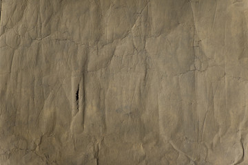 A detail of brown scratched paper background