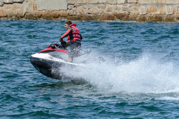 man is riding a hydrocycle