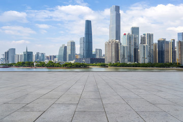 Urban skyscrapers with empty square floor tiles