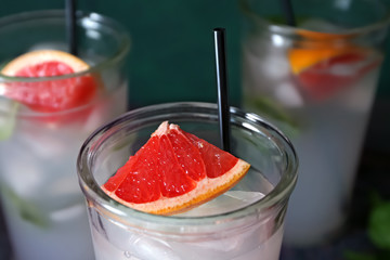 Refreshing grapefruit lemonade in glass, closeup