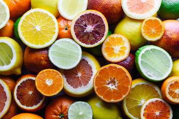 Fototapeta na wymiar Mix of different citrus fruits closeup. Healthy diet vitamin concept. Food photography