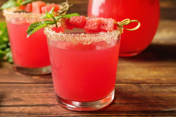 Glasses of fresh watermelon lemonade on wooden table