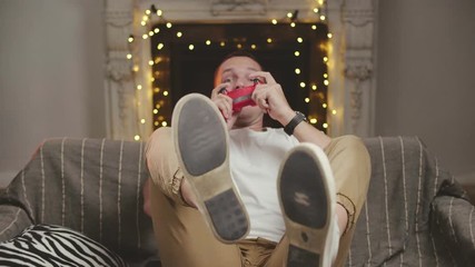 Handsome guy playing absorbedly racing game on playstation