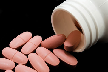 Medications and pills, tablets on a black background