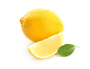 Ripe lemon and slice on white background