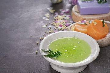 Plate with soft soap on dark background