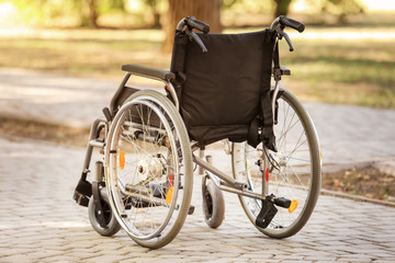 Fototapeta na wymiar Empty modern wheelchair outdoors