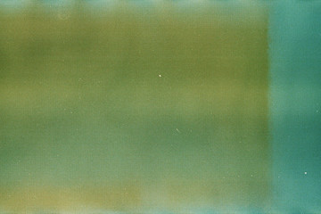 Green and yellow background of the developed film. Edge of the film - 223533250