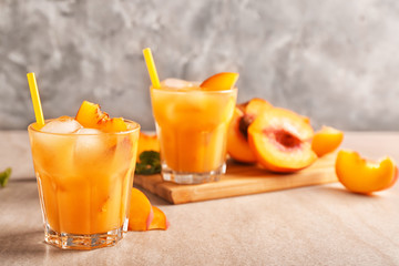 Fresh summer cocktail in glass on grey table