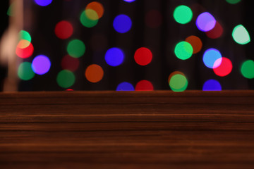 Closeup view of wooden table with glowing lights