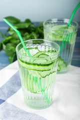 Glass of cucumber infused water on table