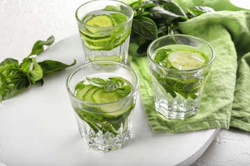 Glasses of cucumber infused water on table