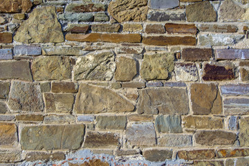 A fragment of the wall of a real medieval castle. Fortress wall of large stone.