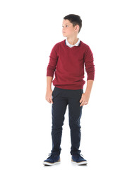 Fototapeta premium preteen serious boy posing in casual clothes and looking away isolated on white