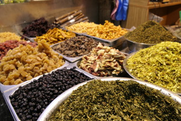 Plates with mix of different spices on plastic shells
