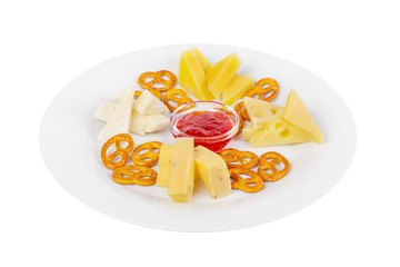 Snack to wine, sweet, a set of cheeses, jam, sweet, salty cookies, aperitif before alcohol, food on plate, white isolated background Side view. For the menu, restaurant, bar, cafe